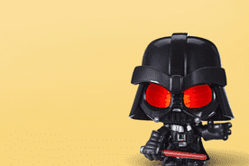 Image shows a black Star Wars Force N telling Vader action figure with red eyes on a yellow background.