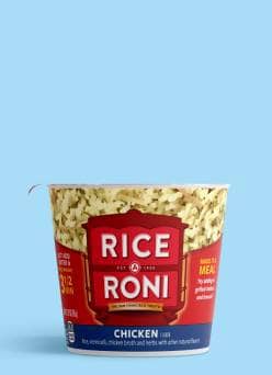 A Rice-A-Roni chicken rice and vermicelli mix cup against a light blue background.