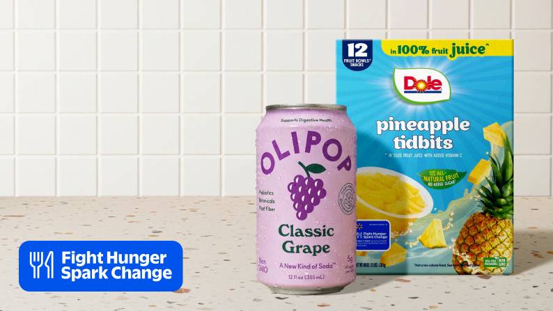 Fight Hunger Spark Change logo. A can of Olipop classic grape and a 12-pack of Dole pineapple tidbits on a counter.